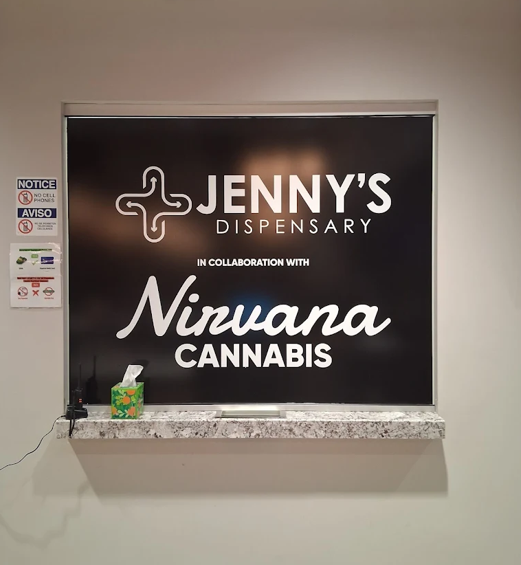 Jenny's Dispensary sign at the counter, in collaboration with Nirvana Cannabis