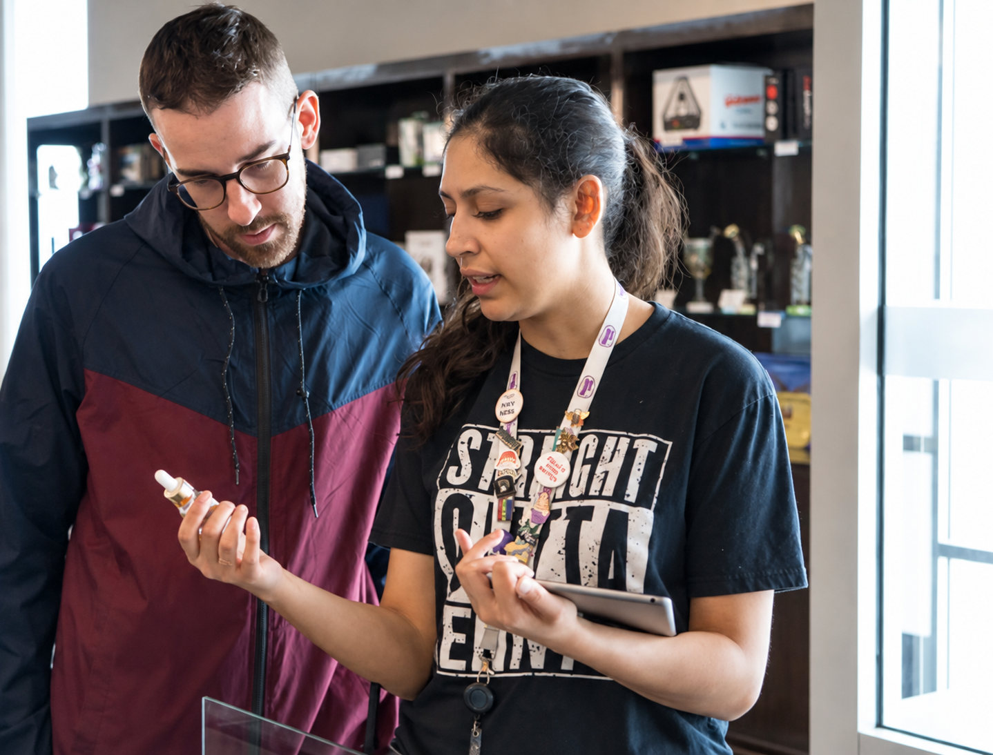 A Jenny's team member walking a customer through products